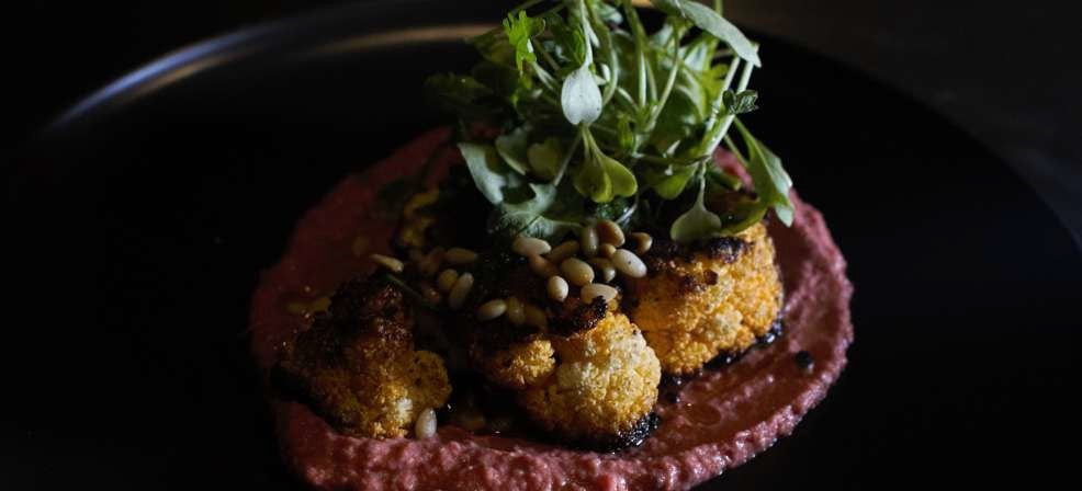 ROASTED CAULIFLOWER STEAKS WITH BEETROOT HUMMUS AND ZHOUG