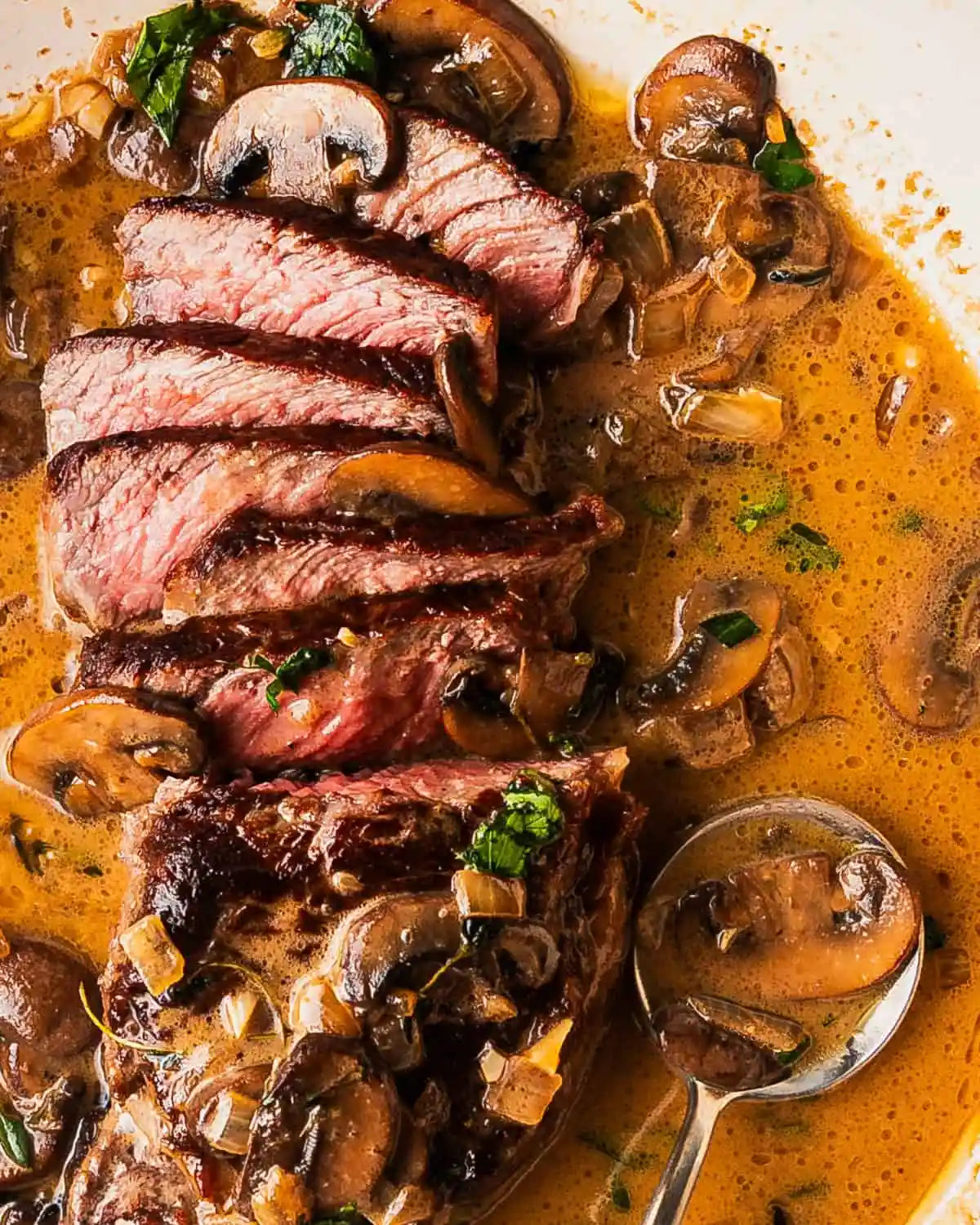 Pan-Seared NY Strip Steak with Creamy Bourbon Mushroom Sauce